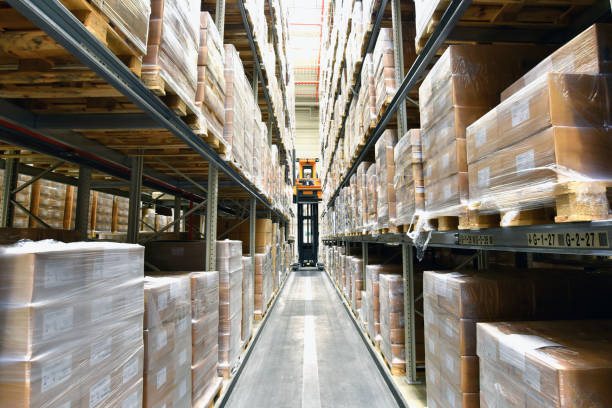 Warehouse aisle with pallet racking and a forklift